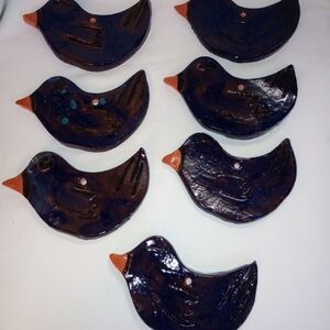 Set of 12 blue and red pottery birds